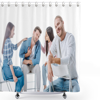 Personality  Selective Focus Of Happy Man Showing Thumbs Up While Sitting On Chair Near Multicultural Support Group Isolated On White Shower Curtains
