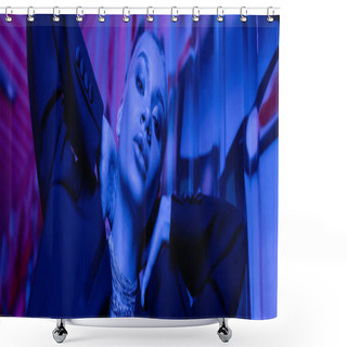 Personality  Low Angle View Of Seductive Woman In Black Blazer And Silver Necklaces Holding Hands Behind Neck In Blue Neon Light, Banner Shower Curtains