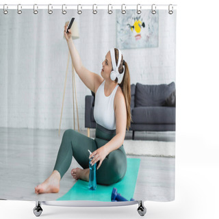 Personality  Side View Of Smiling Plus Size Sportswoman In Headphones Taking Selfie On Smartphone Near Sports Bottle On Fitness Mat  Shower Curtains