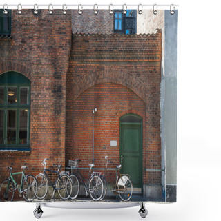 Personality  Parked Bicycles Near Brick Wall Of Building Of Copenhagen, Denmark Shower Curtains