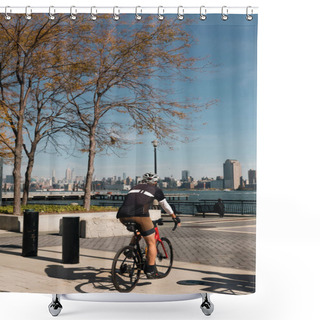 Personality  NEW YORK, USA - OCTOBER 11, 2022: Man Biking On Hudson River Waterfront Walkway At Daytime  Shower Curtains