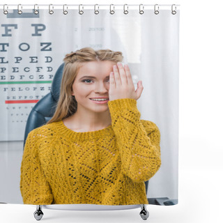Personality  Young Female Patient With Eye Test In Clinic With Eye Chart Behind Shower Curtains