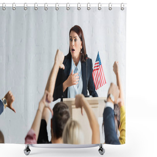 Personality  Shocked Political Agitator In Front Of Voters Showing Thumbs Down In Conference Room, Blurred Foreground Shower Curtains