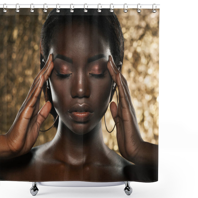 Personality  Fashion studio portrait of an extraordinary beautiful african american model with closed eyes  over golden background shower curtains