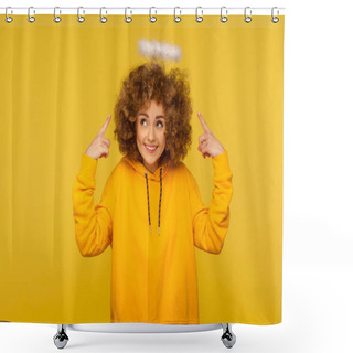 Personality  Portrait Of Charming Angel With Halo, Kind Curly-haired Hipster Woman Pointing At Saint Nimbus Over Her Head And Smiling With Obedient Modest Expression. Studio Shot Isolated On Yellow Background Shower Curtains