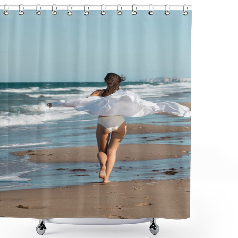Personality  back view of barefoot woman in white shirt and swimwear running with outstretched hands near ocean on beach  shower curtains