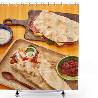 Personality  Top View Of Fresh Sandwich With Salami In Pita And Burrito With Chicken On Boards Near Sauces On Orange Background Shower Curtains