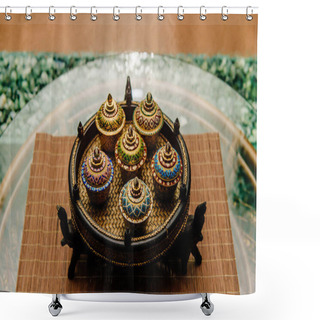 Personality  Traditional Thai Famous Porcelain Benjarong Ceramic Decorative Bowls On Wicker Plate With Elephants Standing On Rattan Table With Glassy Surface With Abstract Falling Water Wall Background. Ceremony. Shower Curtains