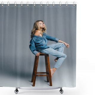 Personality  Seductive Young Woman In Denim Shirt And Jeans, With Naked Shoulder, Sitting On High Chair On Grey Shower Curtains