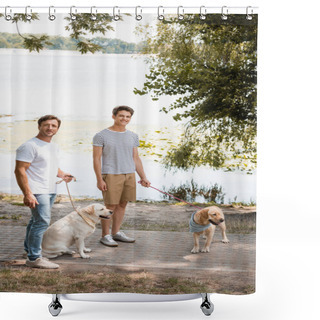 Personality  Father And Son Holding Leashes While Standing With Golden Retrievers Near Lake  Shower Curtains