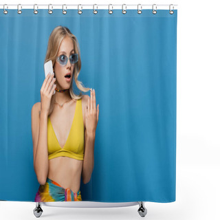 Personality  Shocked Young Woman In Yellow Bikini Top Talking On Smartphone Isolated On Blue Shower Curtains