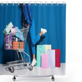 Personality  Cropped View Of African American Woman With Shopping Cart Full Of Gifts Near Shopping Bags On Blue Background Shower Curtains