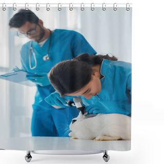 Personality  Selective Focus Of Veterinarian Examining Rabbit With Otoscope While Colleague Writing Prescription  Shower Curtains