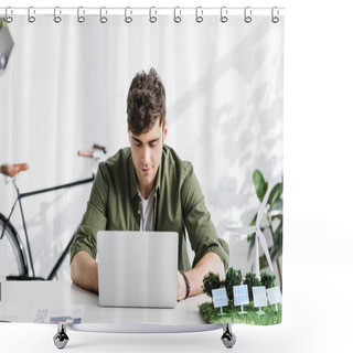 Personality  Handsome Architect In Green Shirt Sitting At Table With Laptop And Windmill, Solar Panels Models In Office Shower Curtains