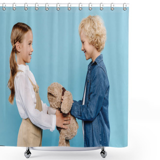 Personality  Side View Of Smiling And Cute Kids Holding Teddy Bear Isolated On Blue  Shower Curtains