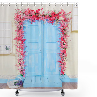 Personality  Spring Decor. Wooden Doors Painted In Blue. Doors Decorated With Pink Flowers. White Wicker Basket. Imitation Of Windows. Lavender In Pots. Shower Curtains