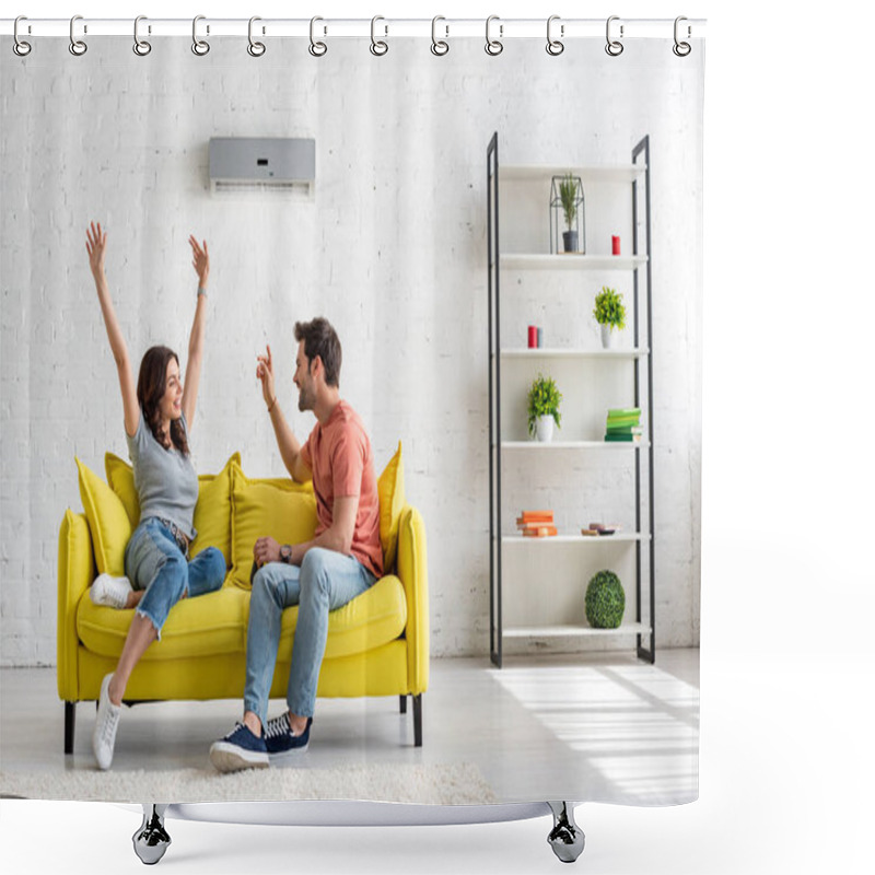 Personality  happy man and woman talking while sitting on yellow sofa under air conditioner at home shower curtains