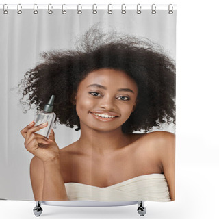 Personality  A Stunning Young African American Woman With Curly Hair Showcasing A Bottle Of Hair Product In A Vivid Studio Setting. Shower Curtains