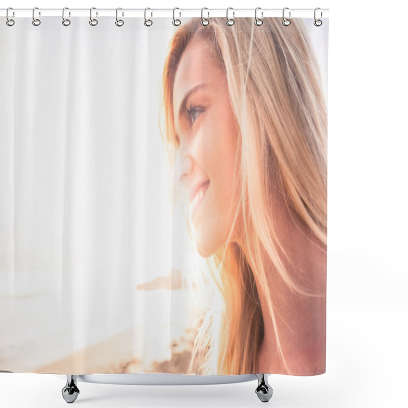 Personality  Close up of a smiling blond looking away at beach shower curtains