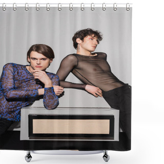 Personality  Young And Stylish Pansexual Partners Posing Near Big Model Of Photo Camera On Grey Background Shower Curtains