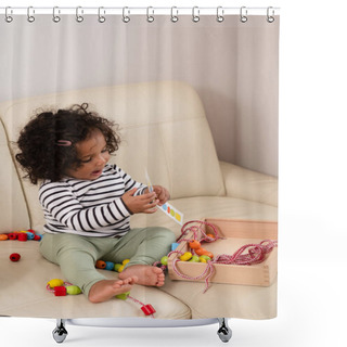 Personality  A Mixed Race Toddler With Curly Hair Plays With Colorful Toys On A Cream Sofa, Immersed In Playtime. Ideal For Childhood And Learning Themes. High Quality Photo Shower Curtains
