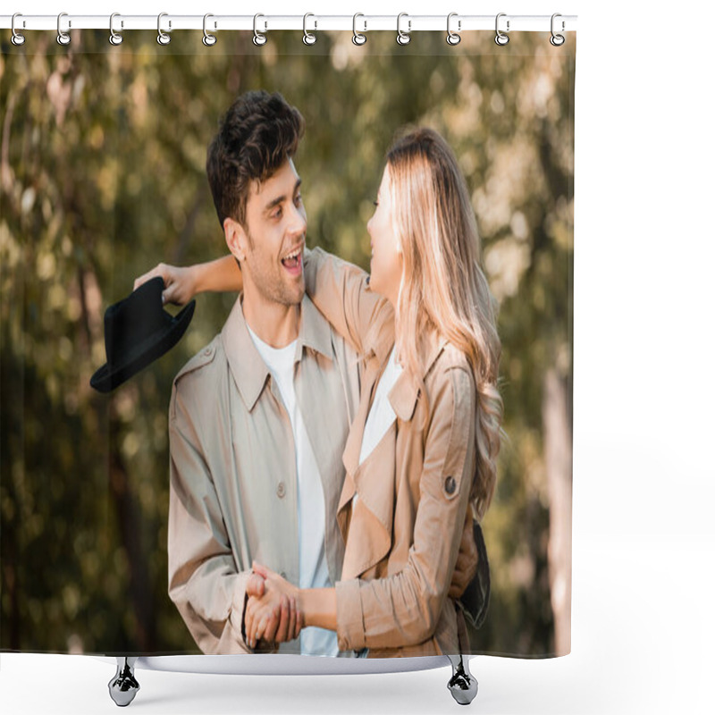 Personality  excited couple holding hands and and looking at each other in autumnal park  shower curtains
