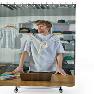 Personality  Young Redhead Craftsman In Casual Clothes Looking Away While Standing Near Laptop And Cloth Samples On Table In Blurred Print Studio, Self-made Success Concept  Shower Curtains