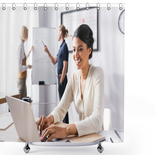Personality  Smiling African American Woman Typing On Laptop While Sitting At Workplace With Blurred Colleagues Working On Background Shower Curtains