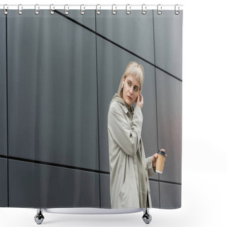 Personality  Blonde Young Woman With Bangs Holding Paper Cup With Coffee To Go While Adjusting Wireless Earphones And Standing In Trendy Outfit, Hoodie And Coat Near Grey Modern Building On Urban Street  Shower Curtains