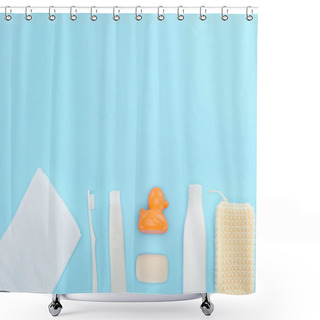 Personality  Top View Of Body Lotion, Toothbrush, Toothpaste, Towel, Soap And Toy Duck, Isolated On Blue Shower Curtains