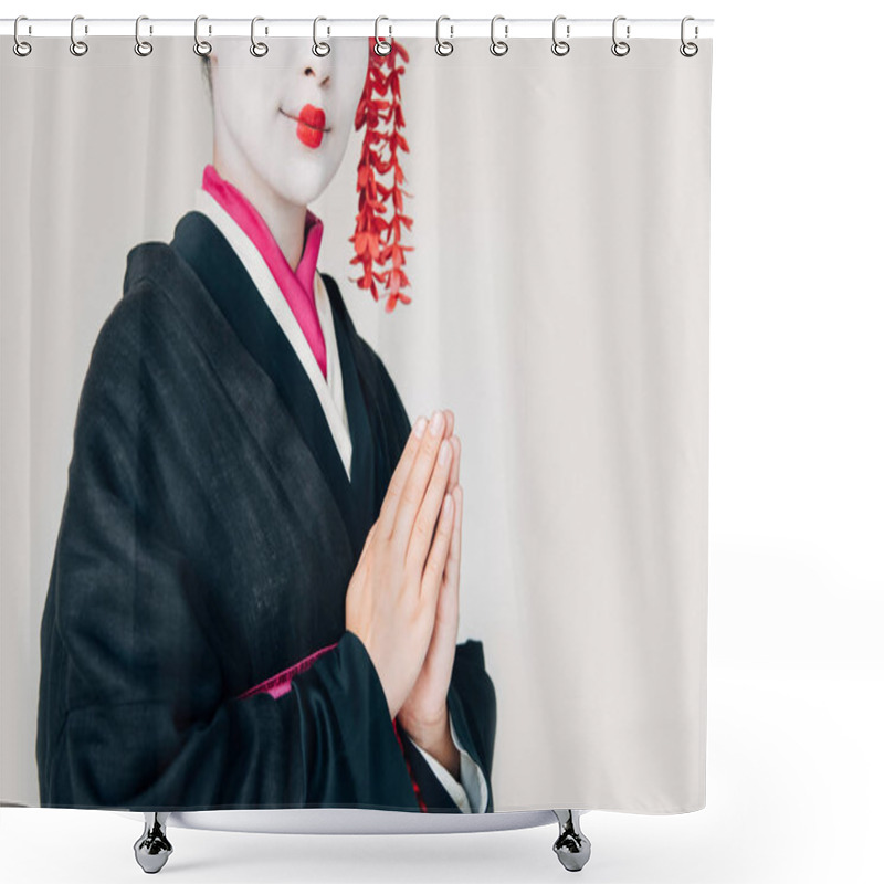 Personality  cropped view of smiling beautiful geisha in black kimono with greeting hands isolated on white shower curtains