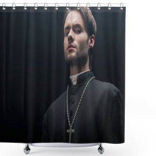 Personality  Low Angle View Of Young Tense Catholic Priest Looking At Camera Isolated On Black Shower Curtains