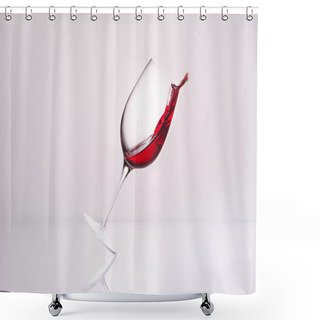 Personality  Inclined Wineglass With Luxury Red Wine On Reflective Surface And On White Shower Curtains