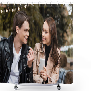 Personality  Cheerful Young Woman Holding Smartphone While Listening Music And Sharing Wired Earphones With Happy Boyfriend  Shower Curtains