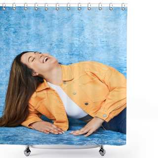 Personality  Body Positive And Happy Plus Size Woman With Long Hair And Natural Makeup Laughing With Closed Eyes While Posing In Orange Jacket And Denim Jeans On Mottled Blue Background  Shower Curtains