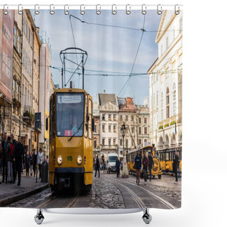 Personality  LVIV, UKRAINE - OCTOBER 23, 2019: Tram With Route Number One Lettering And People Walking Along Street In City Center Shower Curtains