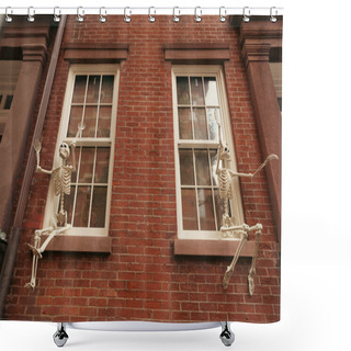 Personality  Low Angle View Of Spooky Skeletons On Window Of Brick House In New York City Shower Curtains