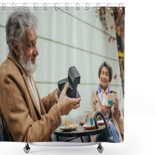 Personality  Happy Bearded Man Holding Vintage Camera And Taking Photo Of Blurred Senior Wife During Breakfast  Shower Curtains