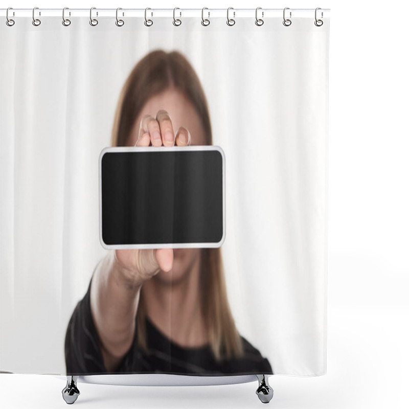 Personality  selective focus of victim of cyberbullying presenting smartphone with blank screen isolated on white shower curtains