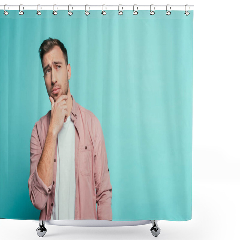 Personality  thoughtful handsome man gesturing and looking up, isolated on blue shower curtains