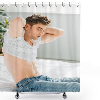 Personality  Handsome Man In Jeans Sitting On Bed Near Window And Taking Off White T-shirt In Bedroom Shower Curtains