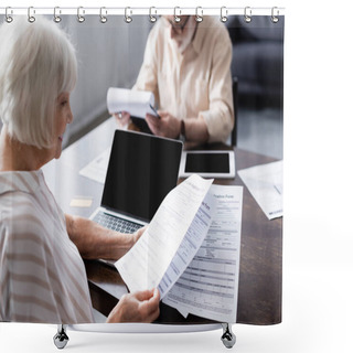 Personality  Selective Focus Of Smiling Senior Woman Holding Papers Near Gadgets And Credit Card On Table  Shower Curtains
