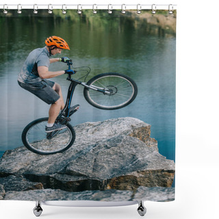 Personality  Extreme Trial Biker Balancing On Back Wheel On Rocky Cliff Over Lake Shower Curtains