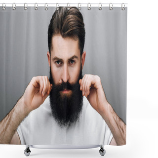 Personality  Horizontal Close Up Portrait Of Brutal Handsome Young Bearded Male Corrects His Moustache And Beard, Looking At The Camera, Wears White Tshirt, On A Gray Studio Wall. Young Barber With Trendy Beard. Shower Curtains