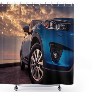 Personality  Blue SUV Car With Sport And Modern Design Parked On Concrete Road By The Sea At Sunset In The Evening. Hybrid And Electric Car Technology Concept. Automotive Industry. Headlamp Shower Curtains
