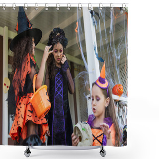 Personality  Girls In Halloween Costumes Holding Skull And Trick Or Treat Bucket Near Decorated Cottage Shower Curtains