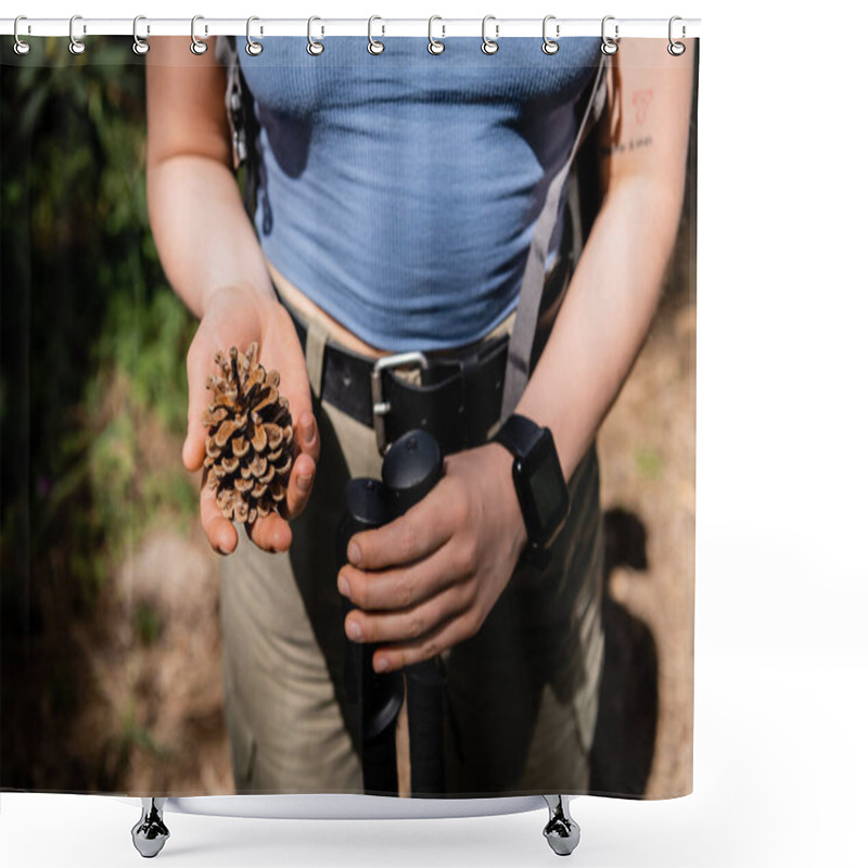 Personality  Cropped View Of Young Tattooed Female Tourist Holding Trekking Poles And Pine Cone While Standing In Blurred Forest During Summer, Hiking For Health And Wellness Concept  Shower Curtains