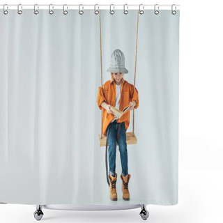 Personality  Cute Kid In Jeans And Orange Shirt Sitting On Swing And Reading Book On Grey Background Shower Curtains