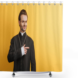 Personality  Smiling Catholic Priest Looking At Camera And Pointing With Finger Isolated On Yellow Shower Curtains