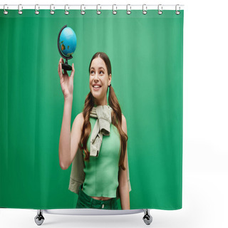 Personality  A Young Beautiful Woman In Her 20s Is Delicately Holding A Mesmerizing Blue Globe In A Studio Setting On Green. Shower Curtains